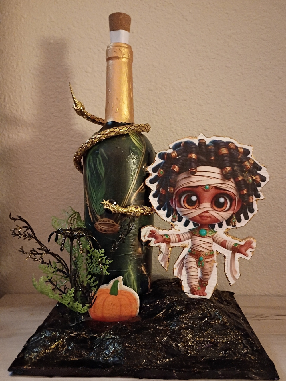 Festive Mummy Halloween Bottle Décor in Green and Gold